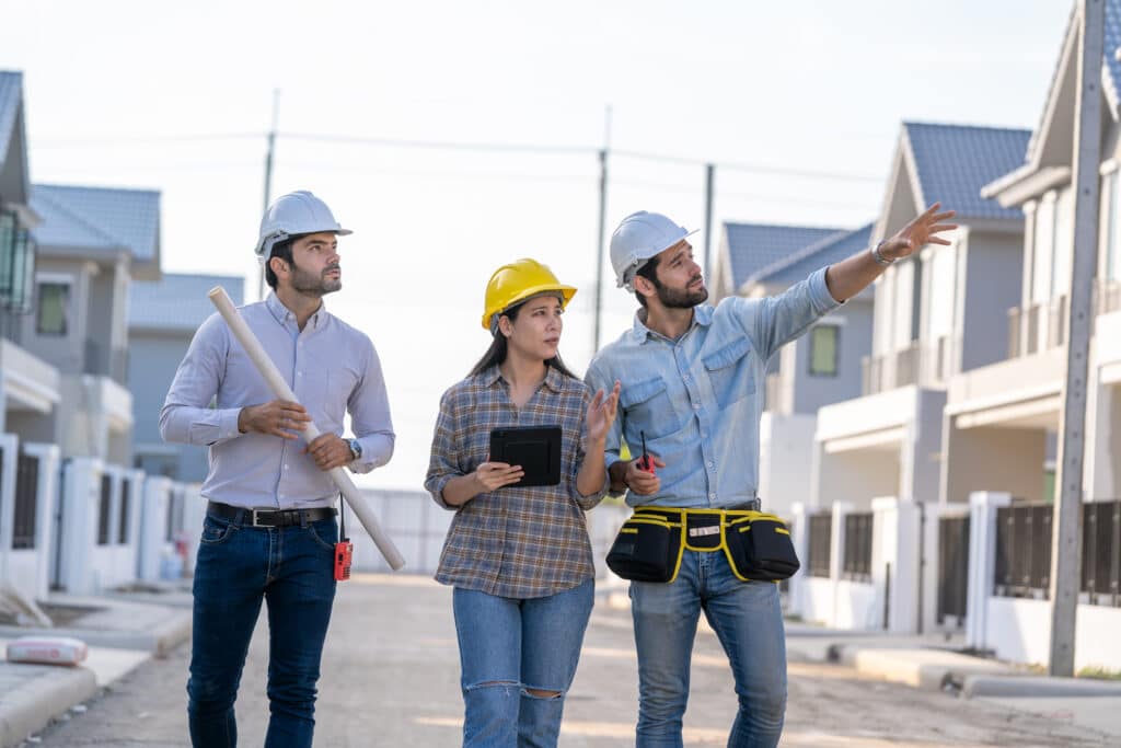 group of builders in working uniform are working on a building site