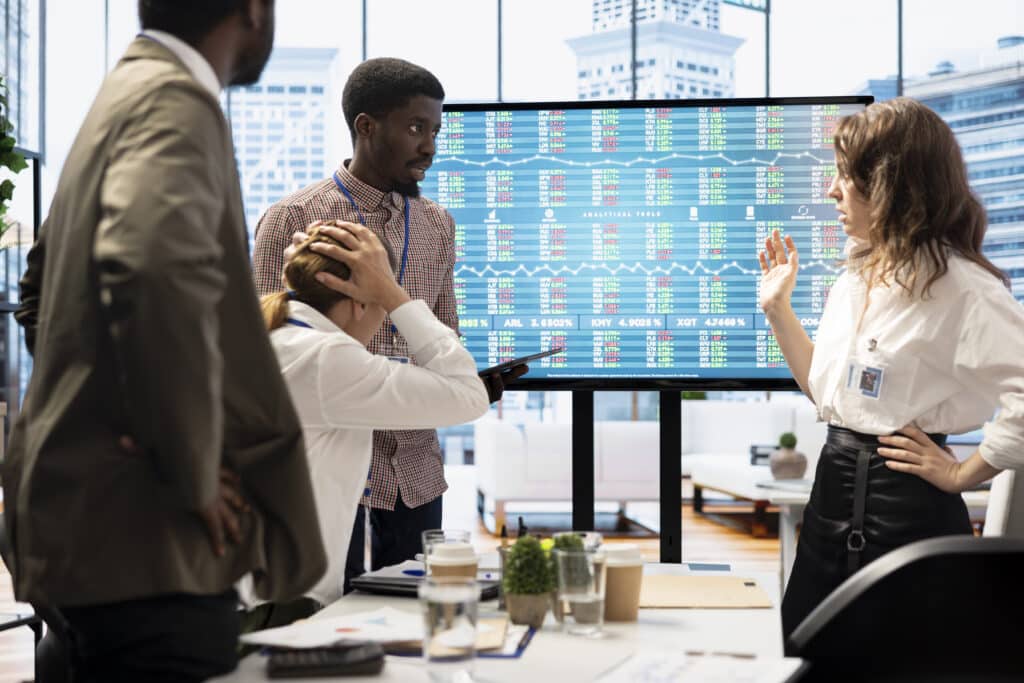 coworkers gather in a boardroom to brainstorm innovative ideas